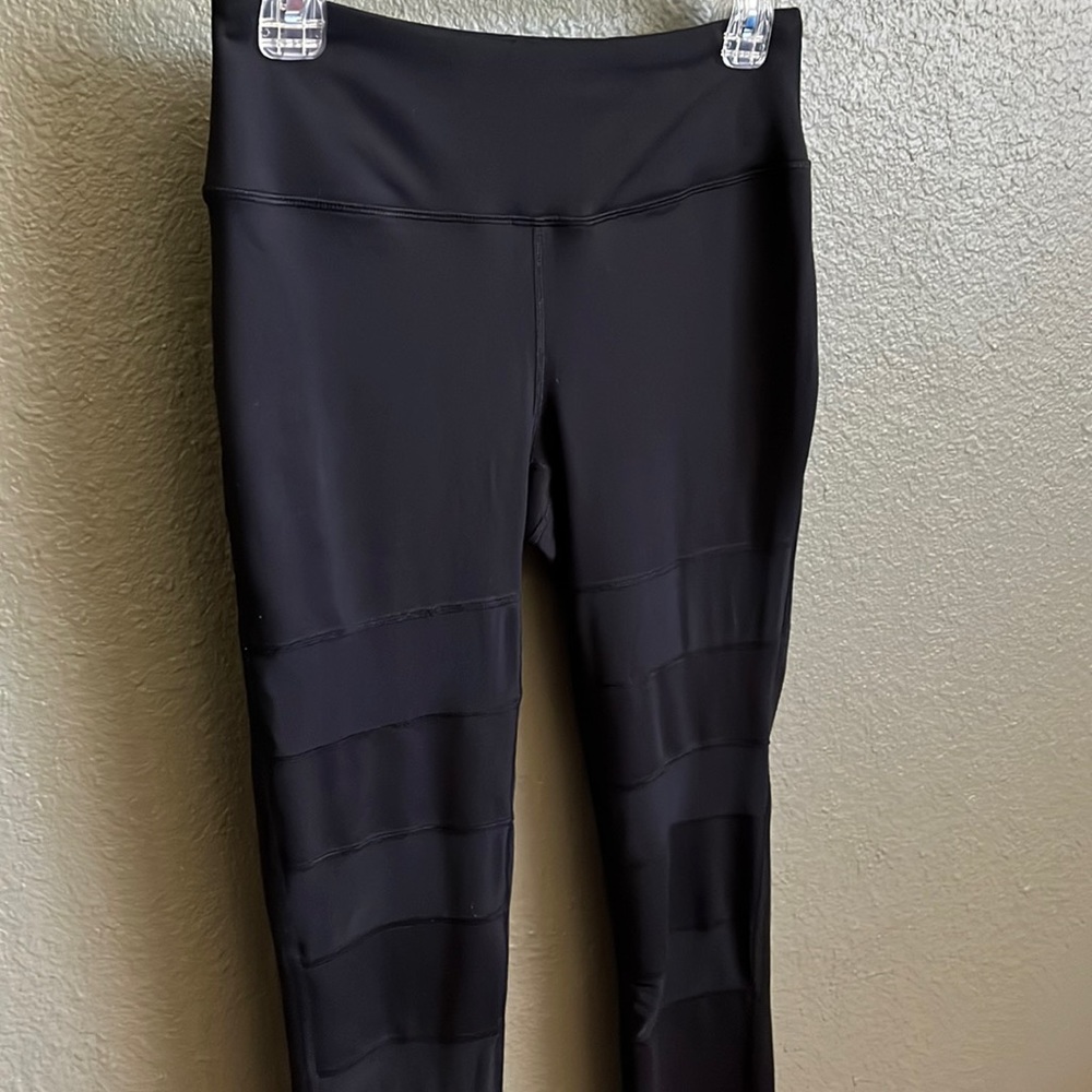 Black workout pants with sheer cutouts